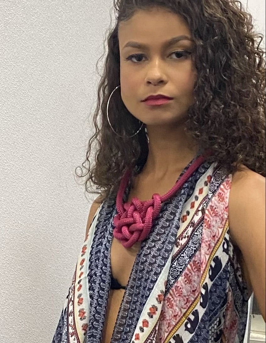 Woman wearing a burgundy hand knotted rope Brave necklace by Alter Ego Designs