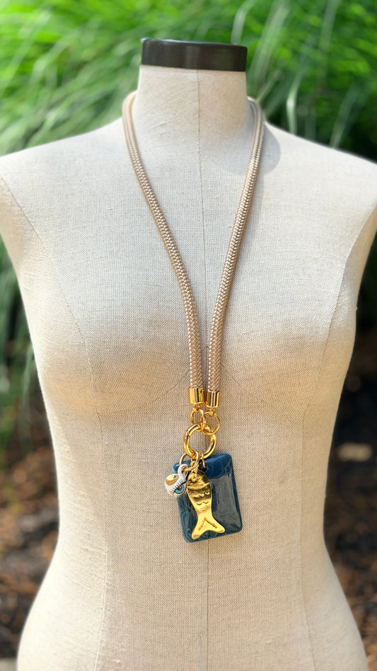 Now Boarding: Long Summer Fish Pendant Necklace on Beige Cord with Azure Blue Resin Focal